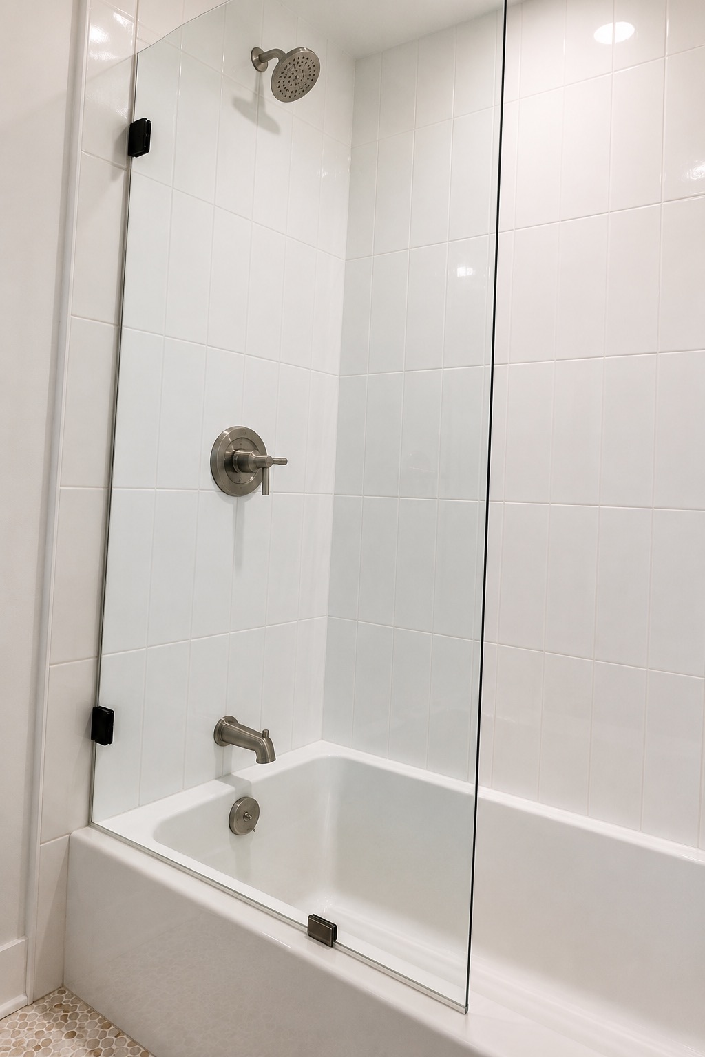 Shower fixtures behind a glass panel