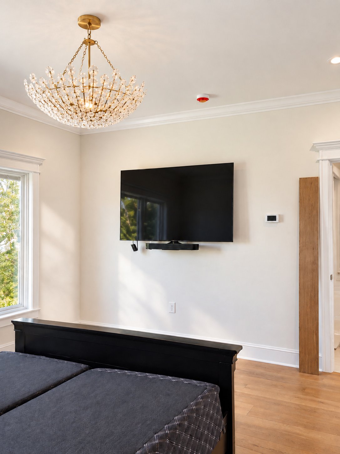 Secondary bedroom media wall with mounted TV
