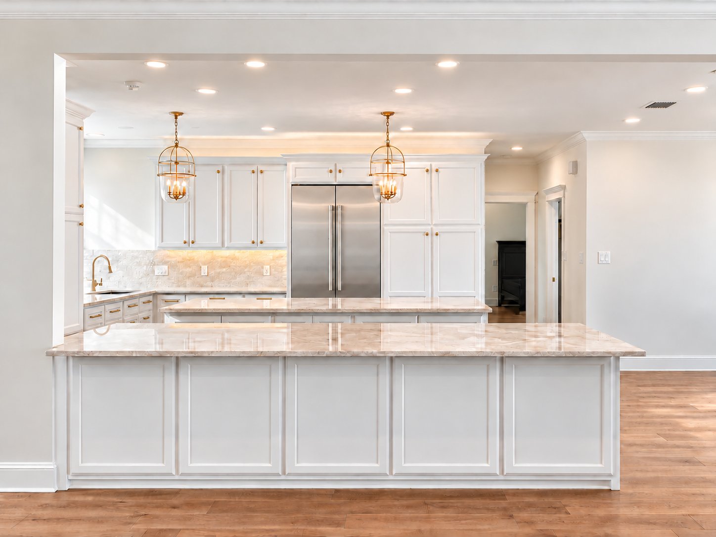 Across the marble island toward the refrigerator wall